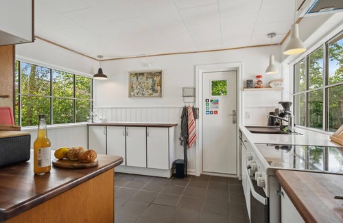 Vejlby Fed House | Spend a wonderful vacation in this comfortable cottage overlooking the sea from the property.