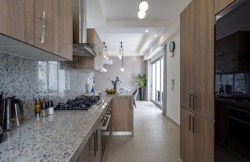 Ensanche Quisqueya Condo | Splendid-KingBed-3BR-Pool-AC-Modern-WiFi-Yellowkey