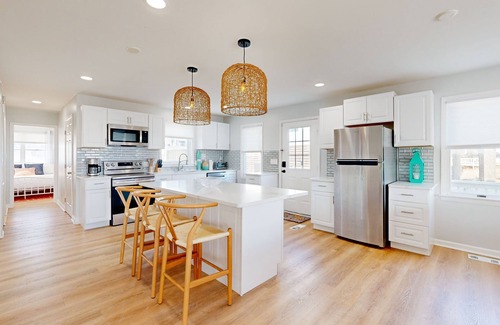 Prime Hook Beach House | Sprawling beachfront home with alfresco dining, grill, games, W/D, & open layout