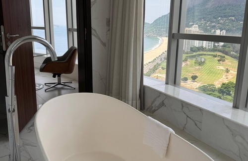 Sao Conrado Hotel | Stay in a work of art with a panoramic bath overlooking sea and mountains.