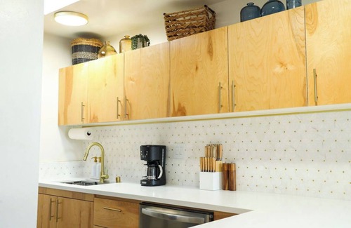 Mission Hills Apartment | Step inside this home and discover a unique blend of mid-century retro-chic, where classic design meets a lively, modern sensibility with clean lines, warm woods, and pops of vibrant color that transport you to a cooler, more carefree era.