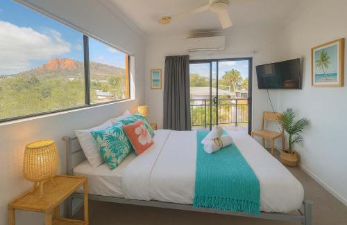 North Ward Apartment | Steps from The Strand 2BR & 2BA Riveria Retreat Pool & Castle Hill Views