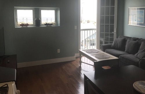 Sea Bright Apartment | Steps to free ocean beach. 40 min ferry ride to NYC. Ocean views from home.