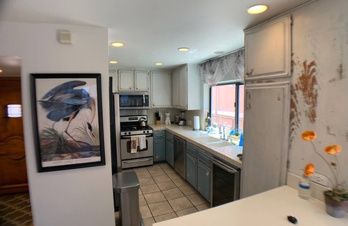 Marina Peninsula Condo | Steps to Sand - Beach condo with Game Room!