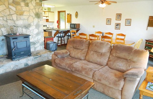 Rangeley House | Stone - This Rangeley Lake home has a very level entry to the water with a huge deck!