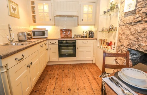 Glanwydden Cottage | STOREHOUSE COTTAGE, romantic, with a garden in Glanwydden