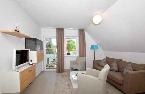 Lobbe Apartment | strandnahe FeWo mit Balkon, gratis Nutzung vom AHOI Erlebnisbad und Sauna in Sellin - Rex Rugia FeWo 30-8
