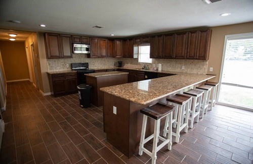 Conroe House | Stucco Private residence for your upcoming gathering.