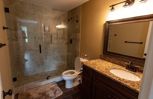 Conroe House | Stucco Private residence for your upcoming gathering.