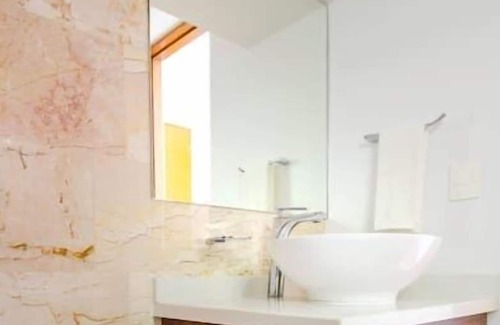 12th Street Apartment | Studio with AC Kitchen Pool Gym and Rooftop view