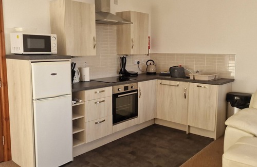 Dinas Apartment | Stunning Beach Front Apartment- Sands - Wendon - Ground Floor