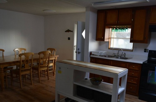 Horseshoe Beach House | Stunning Gulf views with Kayaks, Pedal Boat, Bikes and Tiki Bar with TV