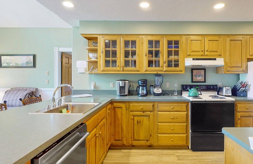 Moultonborough House | Stunning lakefront property with beach access, a dock, spacious yard, & W/D