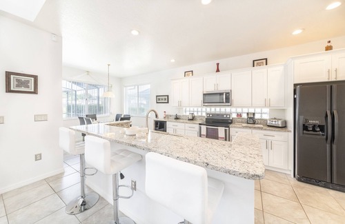 Sunset Lakes Villa | Stunning lakeside location 2 king masters , games room, hot tub 4 miles Disney.