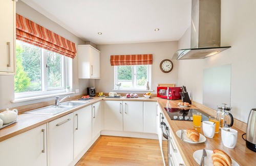 Menai Bridge Ski Chalet | Stunning lodge built over the edge of the lake.