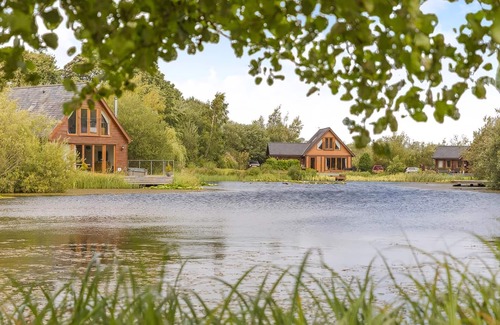 Menai Bridge Ski Chalet | Stunning lodge built over the edge of the lake.