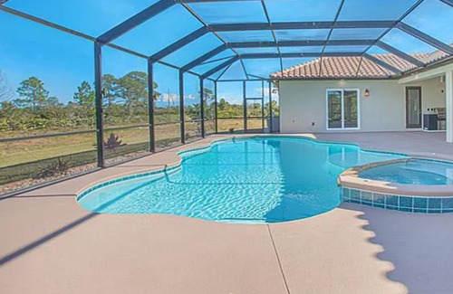 Grant-Valkaria Villa | Stunning Mediterranean-style estate with spillover hot tub/pool! Atlantic Oasis!