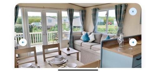 Heacham Ski Chalet | Stunning river view 2 bedroom caravan with decking