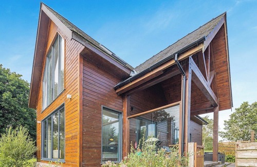Menai Bridge Ski Chalet | Stunning two storey contemporary lodge on the edge of the lake.