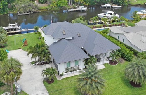 Palm City House | Stunning Water Front River House with Gourmet Kitchen & Large Boat Dock!