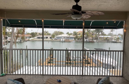 Capri Isle Apartment | "Stunning Waterfront Apartment on Treasure Island with Dock"