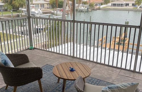 Capri Isle Apartment | "Stunning Waterfront Apartment on Treasure Island with Dock"