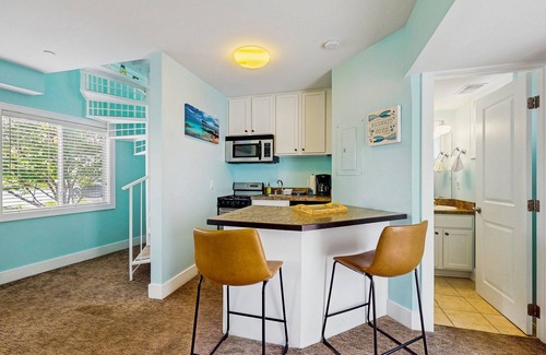 Douglas Condo | Stylish condo with well-equipped kitchen, pool, firepits, & gas fireplace