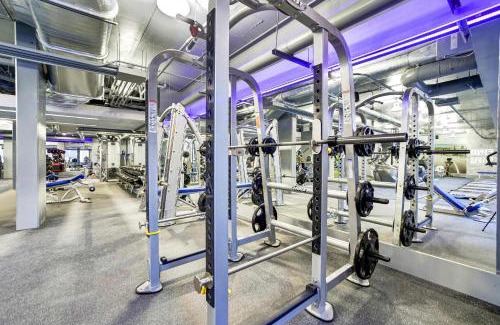 Aurora Highlands Apartment | Stylish Crystal City Flat - Pool & Fitness