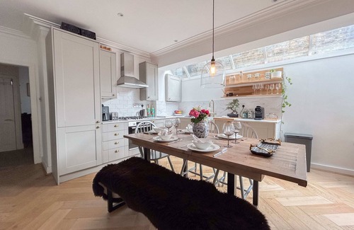 Sands End Apartment | Stylish Hideaway with Oasis Garden
