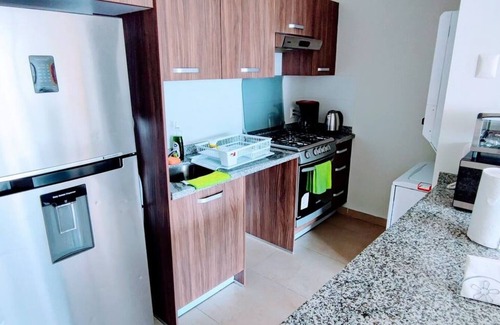 Granada Apartment | Stylish High-Rise Escape: Pool, Hot Tub & Cinema, King-Size Bed and High-Speed WiFi.