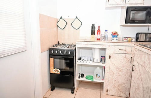 Rock Sound Apartment | Stylish Island Stay| Private Patio + A/C + Wine