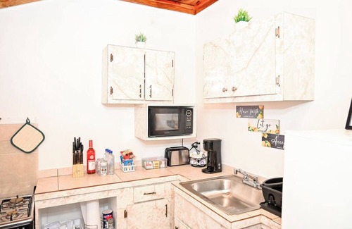 Rock Sound Apartment | Stylish Island Stay| Private Patio + A/C + Wine