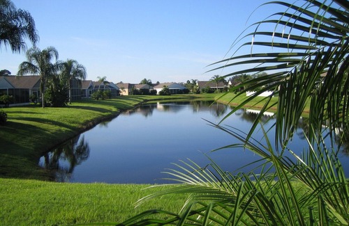 Sabal Harbour Villa | Stylish Lakefront Villa with South Facing Pool. A short drive to fine beaches.