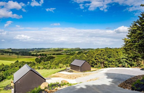 Mangawhai Villa | Stylish Space with a Green Rural outlook peaking to the Mangawhai Sand Dunes and