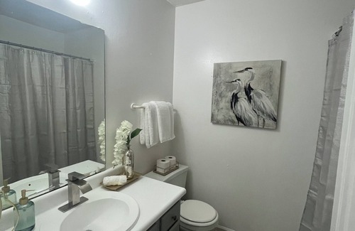 Greensboro House | Stylish Townhome Guest Room with Guest Bath