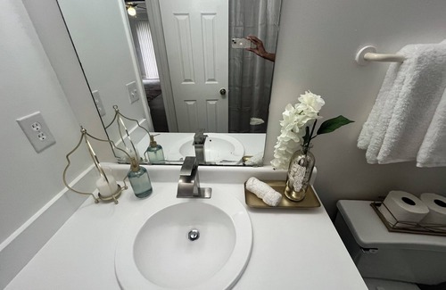 Greensboro House | Stylish Townhome Guest Room with Guest Bath