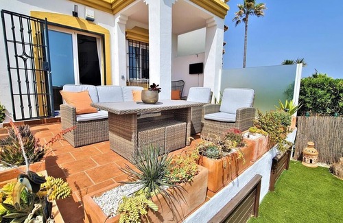 Bahia de Casares House | Stylish townhouse, seaviews, air-con and garden, 10 mins walk to the beach and large communal pool