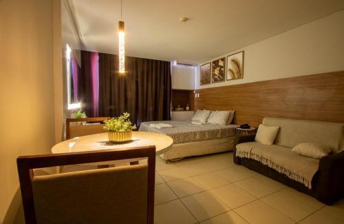 Caminho das Arvores Apartment | Suíte luxo com tela de cinema no América Towers Studio Residence