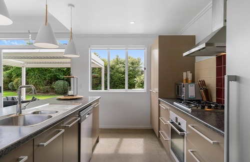 Mangawhai House | Sun Central - Modern, sunny holiday home in tranquil garden setting