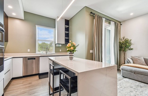Historic Old Northeast Apartment | Sun Soaked Designer Condo with Patio