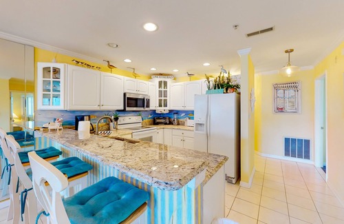 Heron Harbour Isle Condo | Sunny Condo w/Private Balcony, Free WiFi, Shared Pools, Tennis Court, and A/C