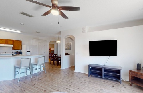 Sunset Ridge House | Sunny home near Disney with enclosed backyard, fast WiFi, W/D, patio, central AC