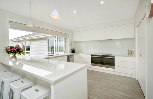 Richmond House | Sunny & spacious modern home with heated swimming pool.