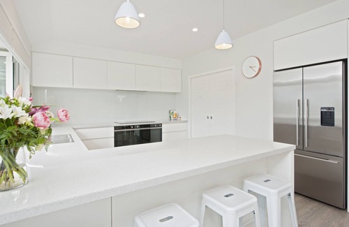 Richmond House | Sunny & spacious modern home with heated swimming pool.