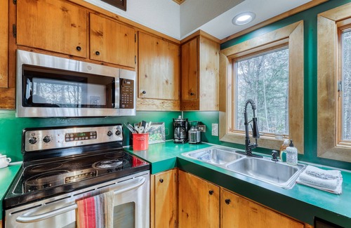 Plymouth House | Sweet chalet with private hot tub, firepit, game room & minibar