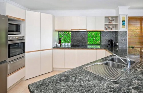 Golden Beach Apartment | Take time to look through the stunning photos of this unique waterfront home.