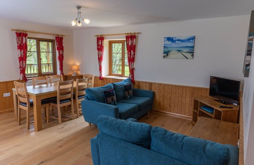 Torrington Cottage | TARKA'S HOLT LOG CABIN, family friendly, with pool in Torrington