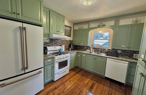Garden District House | The Blue Gable Downtown CDA. Hot Tub, Home Theater, Game Room, 2 King Beds!