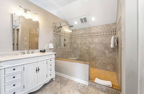 Lexington Bed & Breakfast | The Blue Ridge Cottage is a second floor room steps from the Main Inn. It has its own private deck and entrance which offer wooded and valley views. This cottage has a private 4 person Sundance Spa tub, and an outdoor propane fire pit. It features a