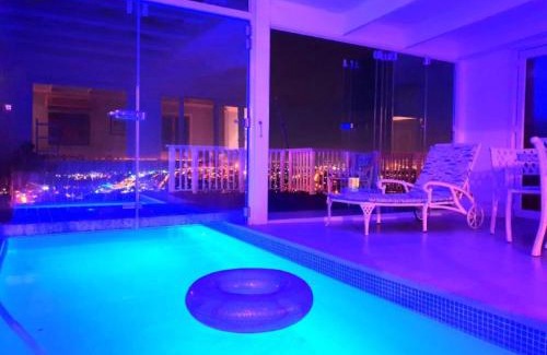 Mountainside House | 'The Bolussi Beachhouse', sleeps 12 in 6 en-suite bedrooms with Indoor Pool